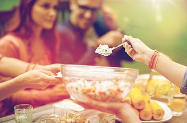 Image showing happy friends having dinner at summer garden party