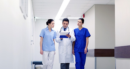 Image showing group of medics at hospital with clipboard