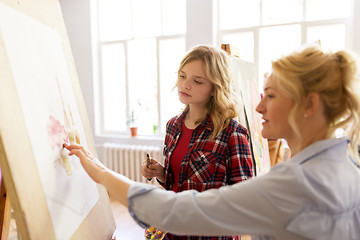 Image showing student and teacher with easel at art school