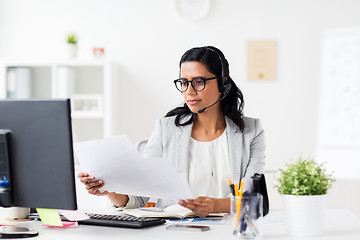 Image showing businesswoman with headset and computer at office