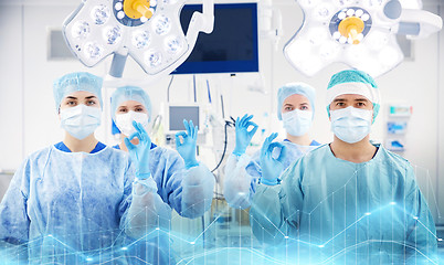 Image showing group of surgeons in operating room at hospital