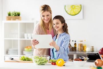 Image showing family cooking dinner using tablet pc at kitchen