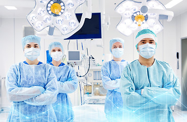 Image showing group of surgeons in operating room at hospital