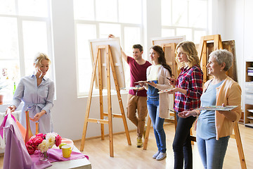 Image showing students and teacher with still life at art school