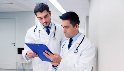 Image showing two male doctors with clipboard at hospital