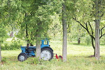 Image showing Old Russian tractor in the garden