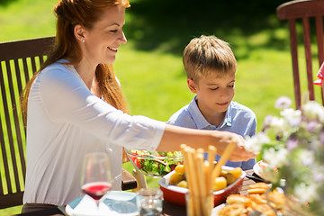 Image showing happy family having dinner or summer garden party