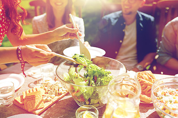 Image showing happy friends having dinner at summer garden party