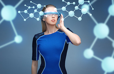 Image showing woman in virtual reality 3d glasses with molecules