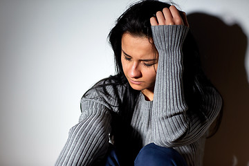 Image showing unhappy woman crying on floor