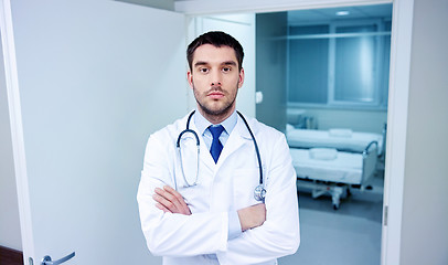 Image showing doctor with stethoscope at hospital corridor