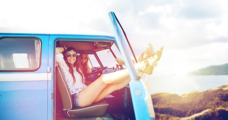 Image showing happy hippie women in minivan car on summer beach