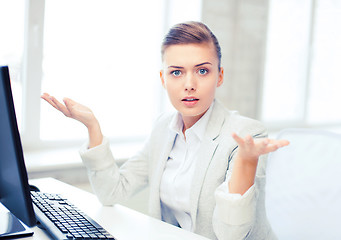 Image showing stressed businesswoman with computer