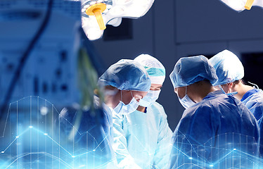 Image showing group of surgeons in operating room at hospital