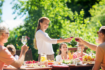 Image showing happy family having dinner or summer garden party