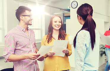 Image showing creative team on coffee break talking at office