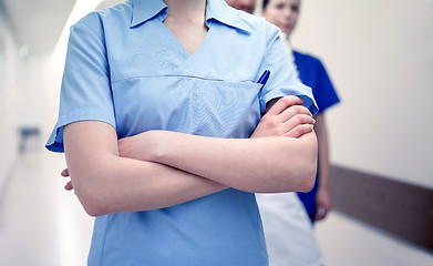 Image showing close up of medics or doctors at hospital corridor