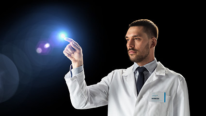 Image showing doctor or scientist in white coat with light