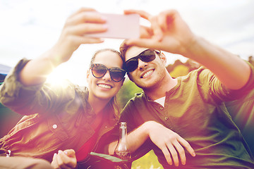Image showing couple of travelers taking selfie by smartphone