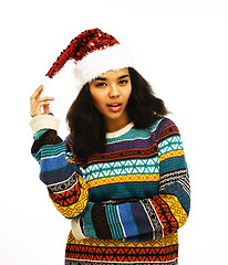 Image showing cute young girl in santas red hat isolated