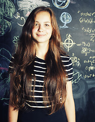 Image showing back to school after summer vacations, cute teen real girl in classroom