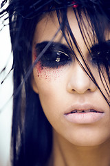 Image showing pretty brunette woman with make up like demon at halloween