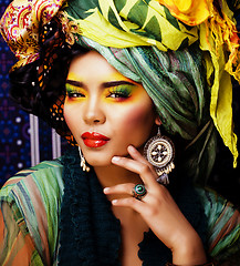 Image showing beauty bright woman with creative make up, many shawls on head like cubian, ethno 