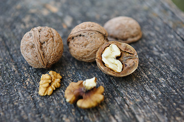 Image showing Walnuts at old wooden plank