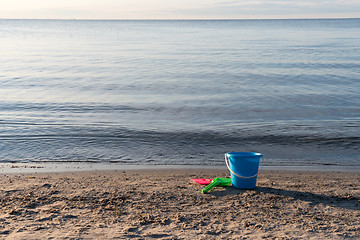 Image showing Sand beach with plastic toys