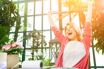 Image showing Image of one cheerful florist