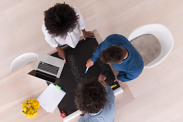 Image showing top view of Multiethnic startup business team on meeting