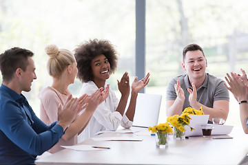 Image showing multiethnic startup Group of young business people celebrating s