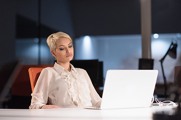 Image showing woman working on laptop in night startup office