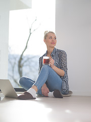 Image showing young woman drinking coffee enjoying relaxing lifestyle