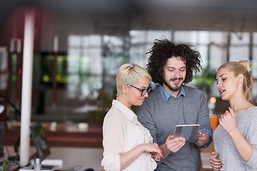 Image showing group of Business People Working With Tablet in startup office