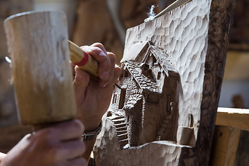 Image showing Sculptor hands working wood