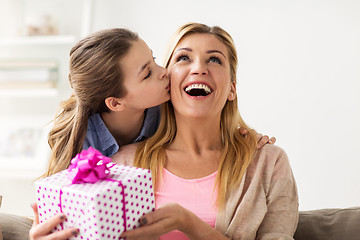 Image showing girl giving birthday present to mother at home