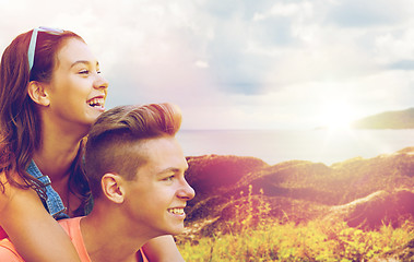 Image showing happy teenage couple having fun outdoors