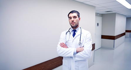 Image showing doctor with stethoscope at hospital corridor