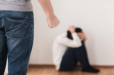 Image showing unhappy woman suffering from domestic violence