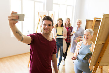 Image showing group of artists taking selfie at art school