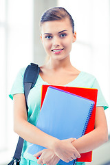 Image showing student girl with school bag and notebooks