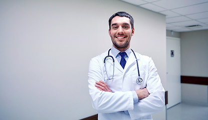 Image showing smiling doctor with stethoscope at hospital 