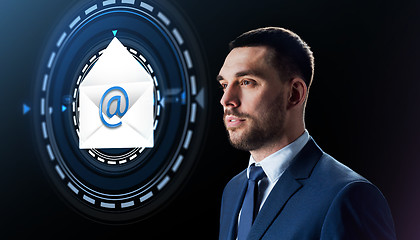 Image showing businessman with e-mail message hologram