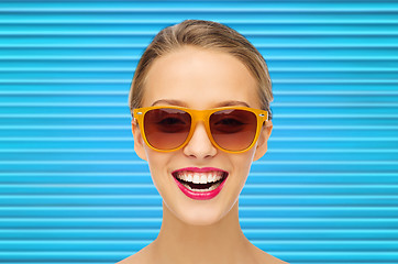 Image showing happy teenage girl or woman face in shades