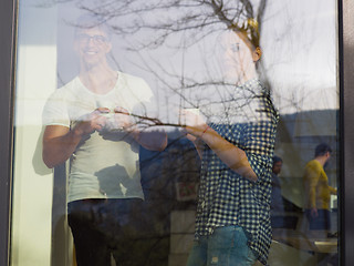 Image showing young couple enjoying morning coffee