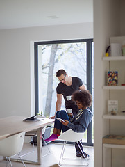 Image showing multiethnic couple relaxing at modern home indoors