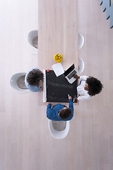 Image showing top view of Multiethnic startup business team on meeting