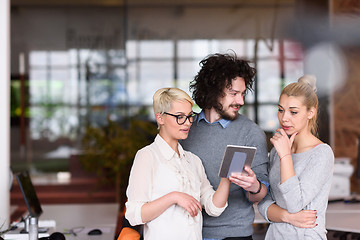 Image showing group of Business People Working With Tablet in startup office