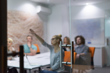 Image showing Startup Business Team At A Meeting at modern night office buildi